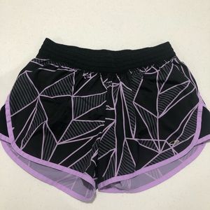 black and purple champion running shorts